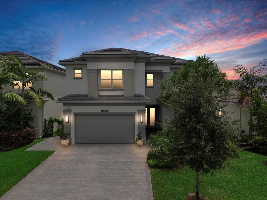 A must see Siena Grande model 3 years new home on premium water lot. Over $90,000 in builder upgrades. Home offers 6 bedrooms plus a loft 5 full bathrooms. 2 bedrooms downstairs with one en-suite. Open floor plan. High end modern lighting. Gourmet kitchen with upgraded cabinets, quartz and granite counters, large center island, appliances with double ovens and pantry with pullouts. Master bath has quartz vanities, cultured marble tub and brushed nickel framed shower doors. Custom built in closets and wood floors throughout. All impact windows and doors. Double sliding glass doors in family room with remote custom blinds open to a backyard oasis. Custom built heated pool with salt system & spa that overlooks lake. Custom summer kitchen with overhead patio and remote awning. A must see!!!