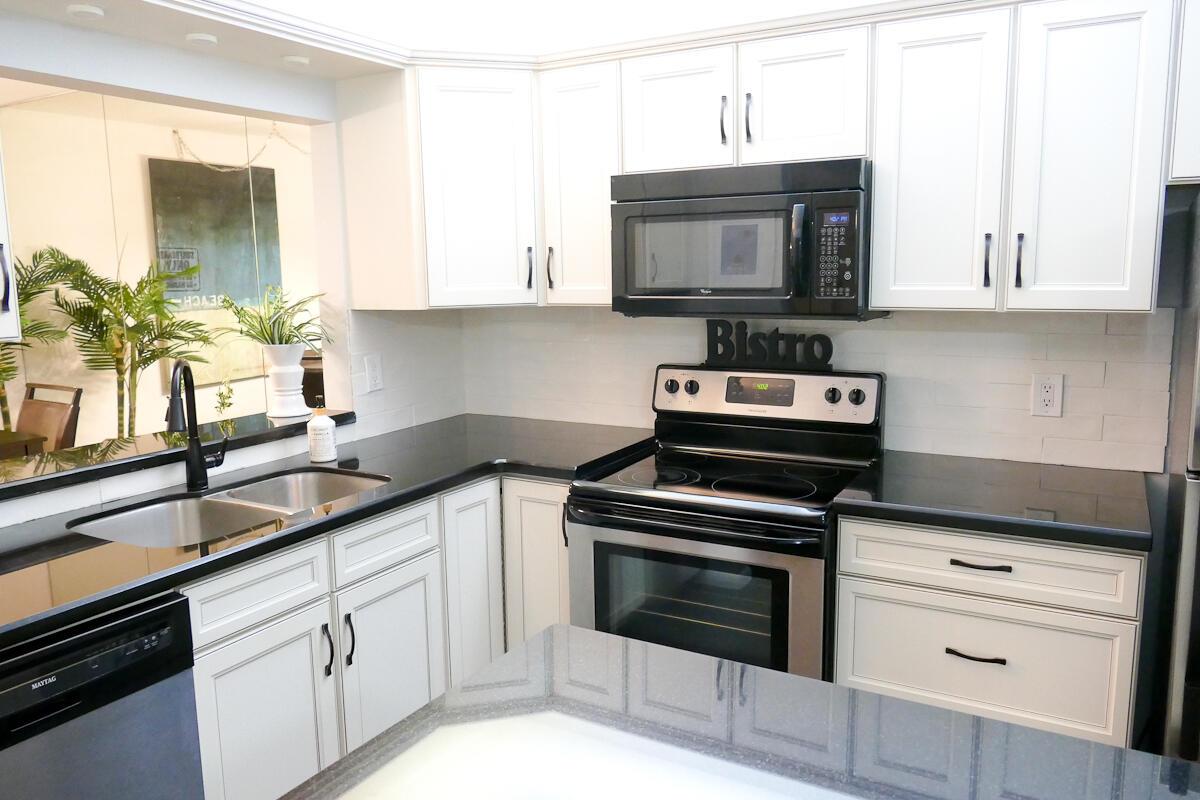 Seller offering up to 4% credit to buyer towards prepaids, closing costs, or buydowns. Beautiful, 2 bedroom/2 bath updated first floor condo features granite countertops, enclosed patio for relaxation. All tile flooring. Newer AC, water heater, IMPACT WINDOWS. Close to Jupiter beaches, hospitals, I-95,restaurants.