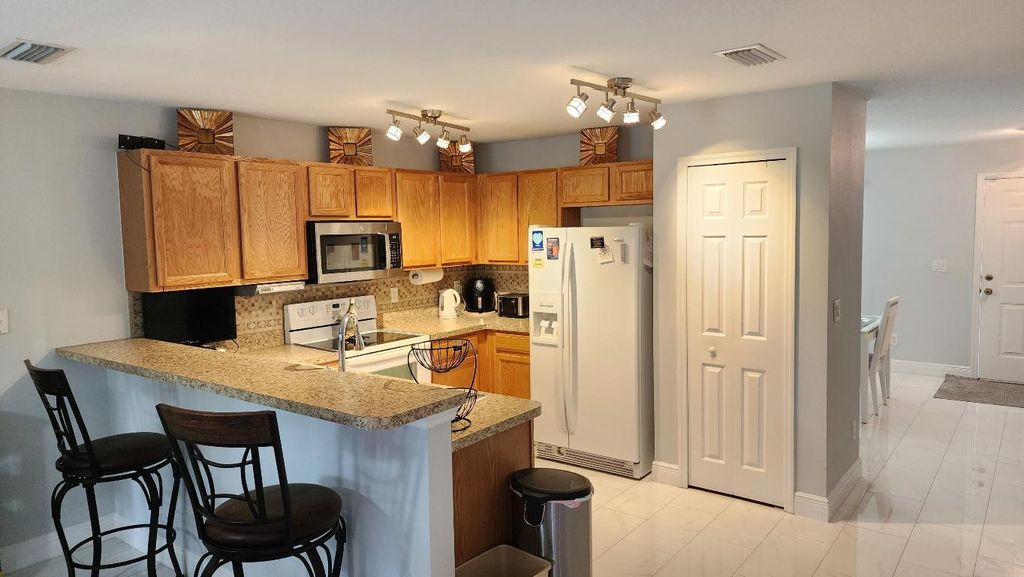 Photo of 562 SE Majestic Terrace, Port Saint Lucie, FL 34983 (MLS # R11136897)