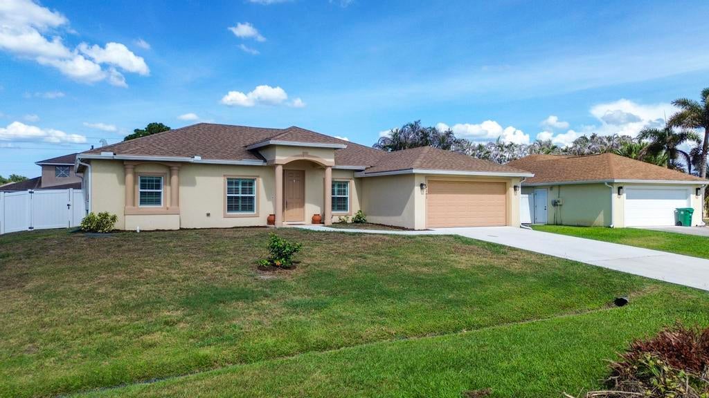 Photo of 4201 SW Mcclellen Street, Port Saint Lucie, FL 34953 (MLS # B26043275)