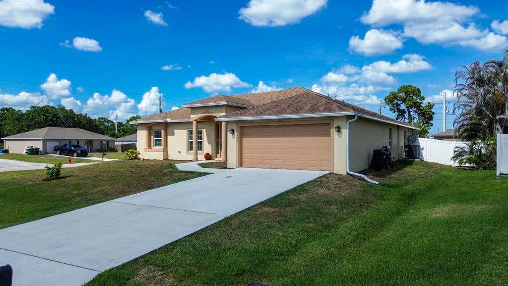 Photo of 4201 SW Mcclellen Street, Port Saint Lucie, FL 34953 (MLS # B26043275)