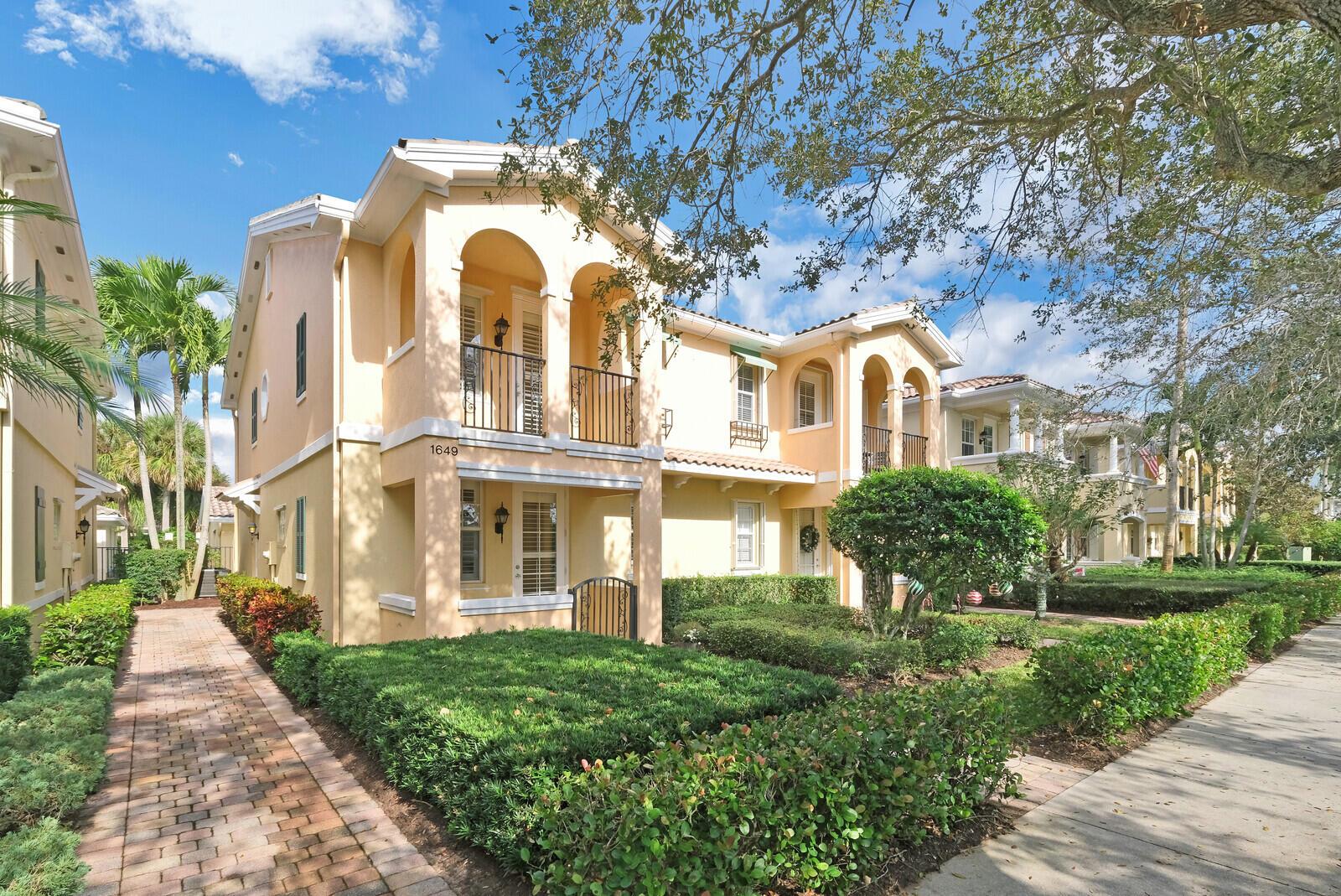 This charming 3-bed, 3-bath townhome offers 1,830 sq. ft. of bright living space with gorgeous wood-look tile and laminate in bedrooms. Enjoy a spacious courtyard perfect for relaxation, and a detached 2-car garage. The open kitchen boasts soft-close cabinets, a new dishwasher and newer appliances. AC 2018, HWH 2024, Roof 2003. This pet-friendly community features a pool, tennis court, basketball court, playground, and a recreation room. Internet and cable is included. Walk to downtown Abacoa for a baseball game, concerts, food truck invasions, or visit Jupiter's beaches just 15 minutes away. Conveniently located 20 minutes from PBI, this home combines charm, convenience, and a perfect location! All A+ rated schools. Drapery and blackout shades excluded. Photos Coming.