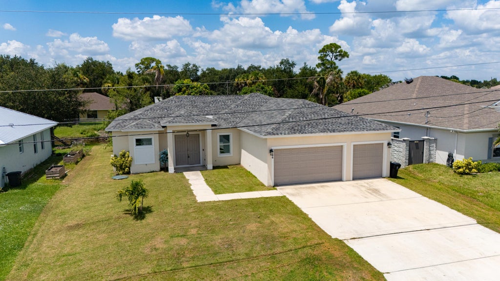 Photo of 2366 SW Blaine Terrace, Port Saint Lucie, FL 34953 (MLS # B26066246)
