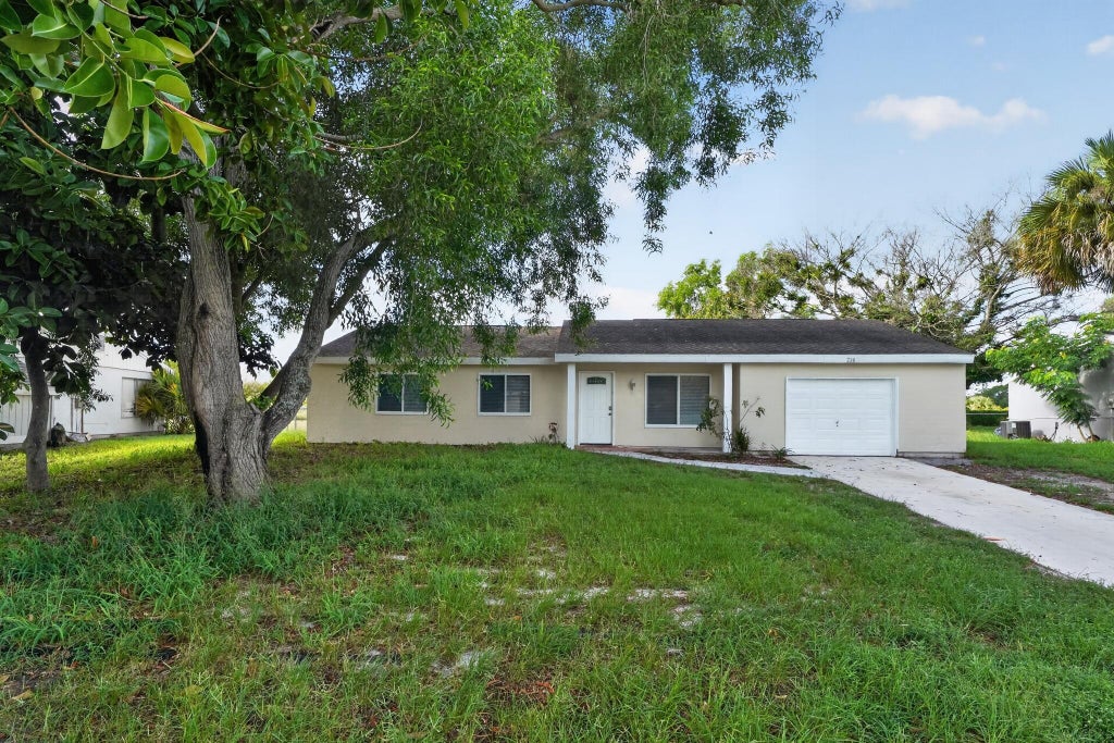 Photo of 230 SW CHERRYHILL Road, Port Saint Lucie, FL 34953 (MLS # B26066418)