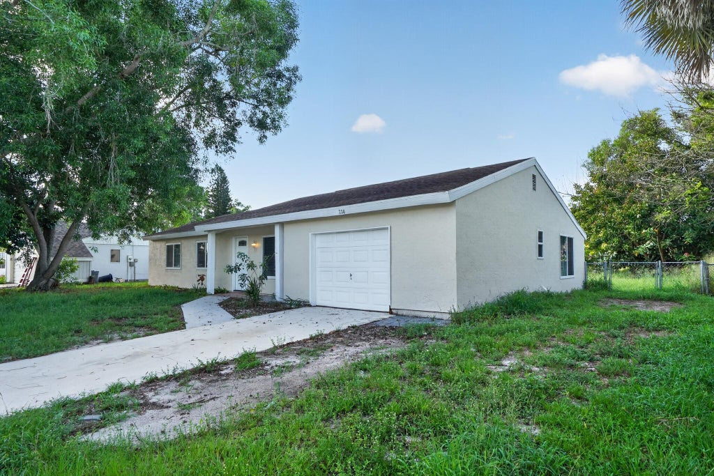 Photo of 230 SW CHERRYHILL Road, Port Saint Lucie, FL 34953 (MLS # B26066418)