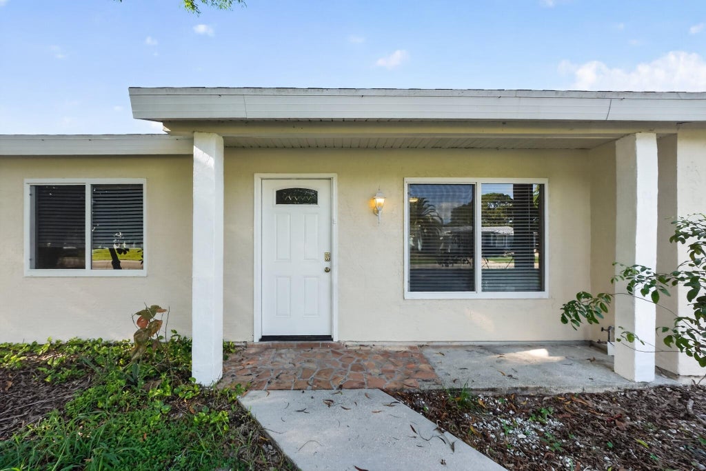 Photo of 230 SW CHERRYHILL Road, Port Saint Lucie, FL 34953 (MLS # B26066418)