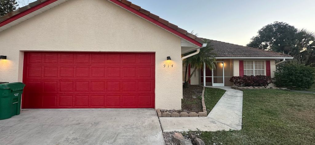 Photo of 914 SW Cecil Lane, Port Saint Lucie, FL 34953 (MLS # R11160119)