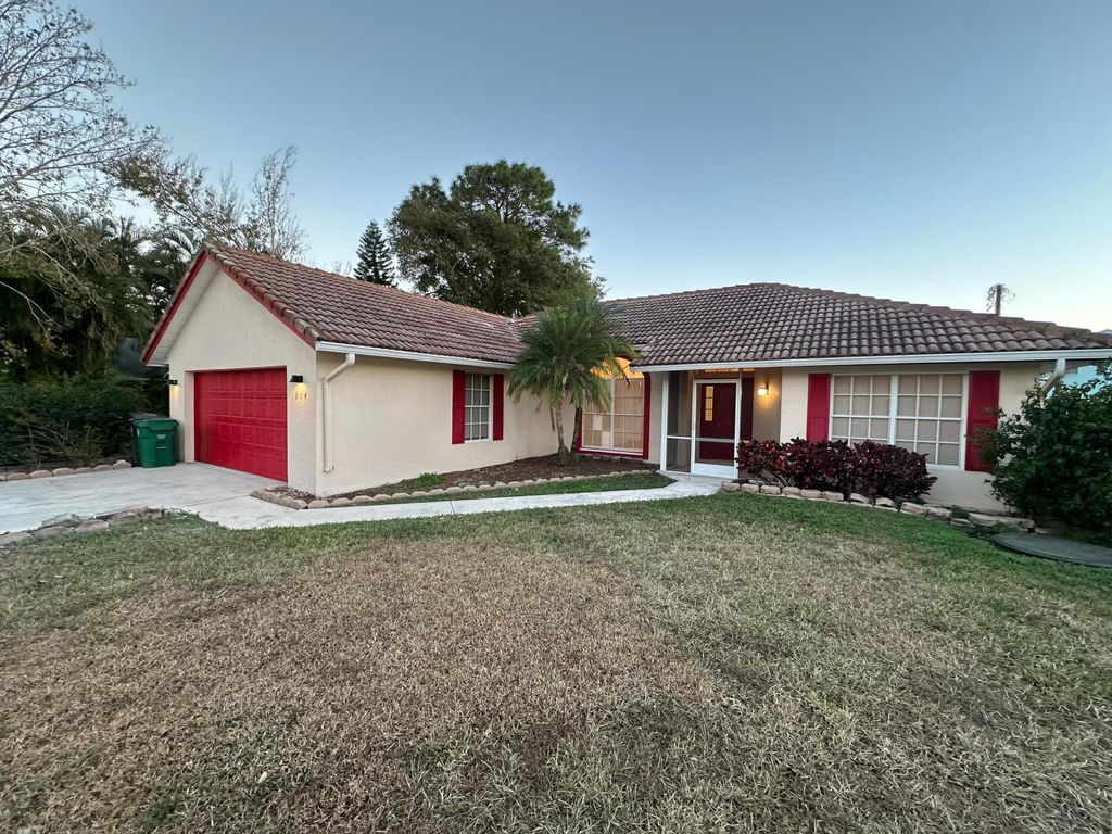 Photo of 914 SW Cecil Lane, Port Saint Lucie, FL 34953 (MLS # R11160119)