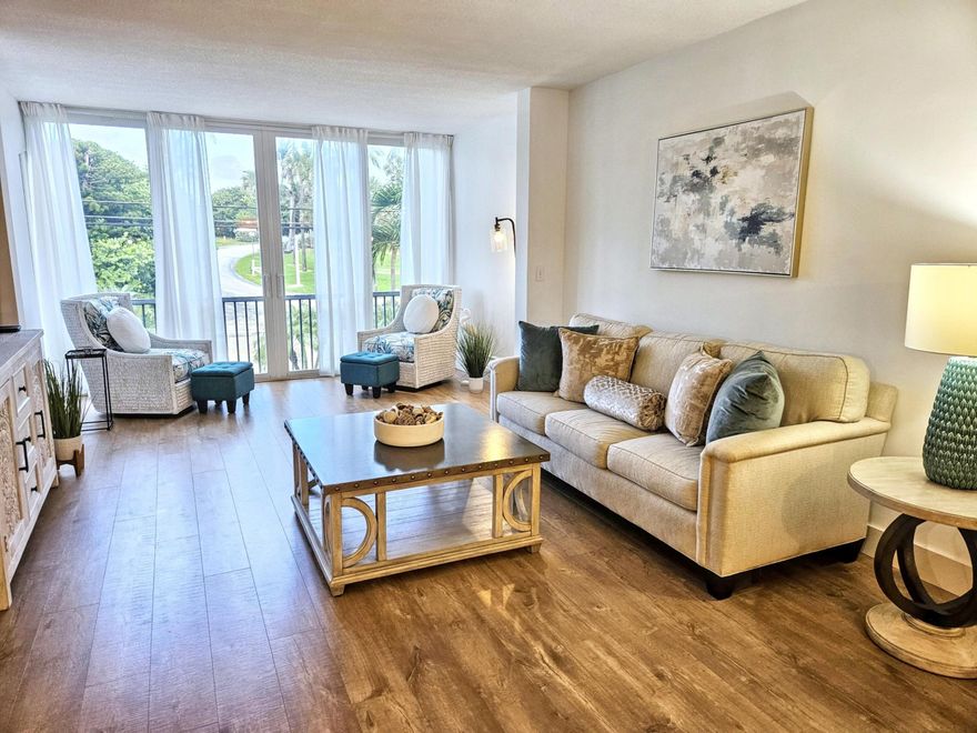 NEW AC, Impact Windows & Modern Upgrades! Nestled between the Intracoastal Waterway and the Atlantic Ocean in the exclusive town of Ocean Ridge, this beautifully updated 2-bed, 2-bath condo offers a rare blend of modern comfort and serene coastal living. Whether you're sipping your morning coffee as the sun rises over the water or unwinding with breathtaking sunsets, this home offers a front-row seat to Florida's natural beauty.

Step inside and be welcomed by sun-filled interiors and a spacious open-concept layout. The renovated kitchen is a standout, featuring new stainless-steel appliances (2024), granite countertops, modern tile backsplash, and crisp white cabinetry with polished gold hardware. Enjoy remarkable water views as you prepare delicious meals for your friends and family. The open concept flow of the kitchen connects seamlessly to the dining area and living room, making it perfect for entertaining. Beautiful honey luxury vinyl plank flooring flows throughout the main living area and evokes a modern yet beachy aesthetic.

Hurricane-impact windows and doors wrap the home in security and peace of mind, while luxurious window treatments and custom Zebra blinds add privacy and style as natural light floods the entire home.

The spacious master suite includes a generous walk-in closet and an updated ensuite bathroom with a modern vanity and shower/tub combo. 

The second bedroom with a spacious walk in closet, located at the front of the unit, is ideal for guests or a home office. A second full bathroom features a walk-in tiled shower and contemporary finishes. New, modern ceiling fans keep the bedrooms cool.

Being offered fully furnished or unfurnished ensuring the home is move-in ready for new owners. The unit is easily accessible via both elevator and stairway for added convenience. 

Wellington Arms residents enjoy a well-maintained community with resort-style amenities: a waterfront pool, BBQ area, seawall fishing, a recreation room, library, kayak/bike storage, private lockers, and convenient on-site laundry.

Just across the street, explore the sand dunes of Ocean Front Beach Park or wander the nature trails of Ocean Ridge Hammock Park. Boaters and fishing enthusiasts will love the proximity to the Boynton Beach Inlet, just 10 minutes away, providing direct access to the ocean.

Located minutes from upscale shopping and dining in Manalapan, vibrant downtown Delray Beach, and Palm Beach, with easy access to I-95, Palm Beach International Airport, and the Brightline train station.

Milestone Structural Safety Inspection has been completed with no required repairs, and all assessments have been paid in full.

Live your coastal dream in Ocean Ridge, where every day feels like a vacation.  Owners are considering all reasonable offers.