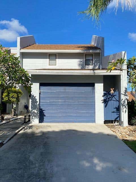 Photo of 1701 WOODBRIDGE LAKES Circle, West Palm Beach, FL 33406 (MLS # B26062323)