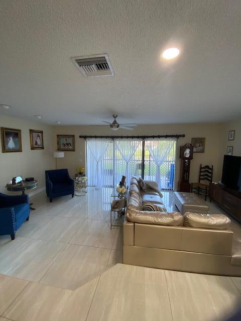 Photo of 1701 WOODBRIDGE LAKES Circle, West Palm Beach, FL 33406 (MLS # B26062323)