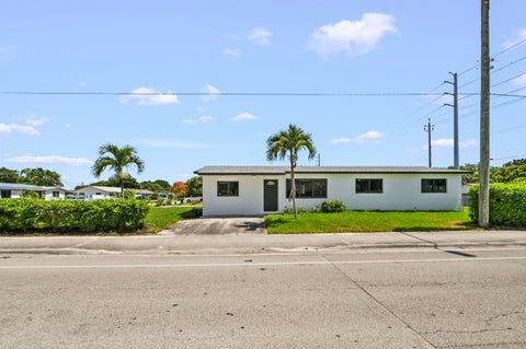 Photo of 3645 Melaleuca Lane, Lake Worth, FL 33461 (MLS # B26047012)