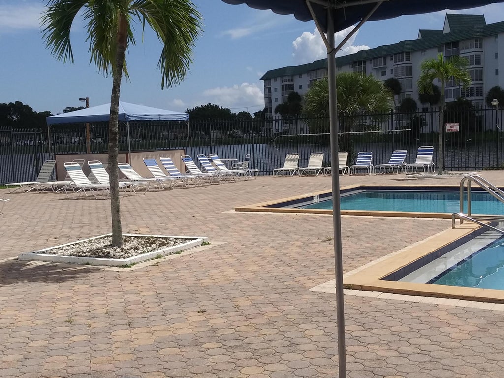 Photo of 4841 NW 22nd Court #215, Lauderhill, FL 33313 (MLS # B26080563)