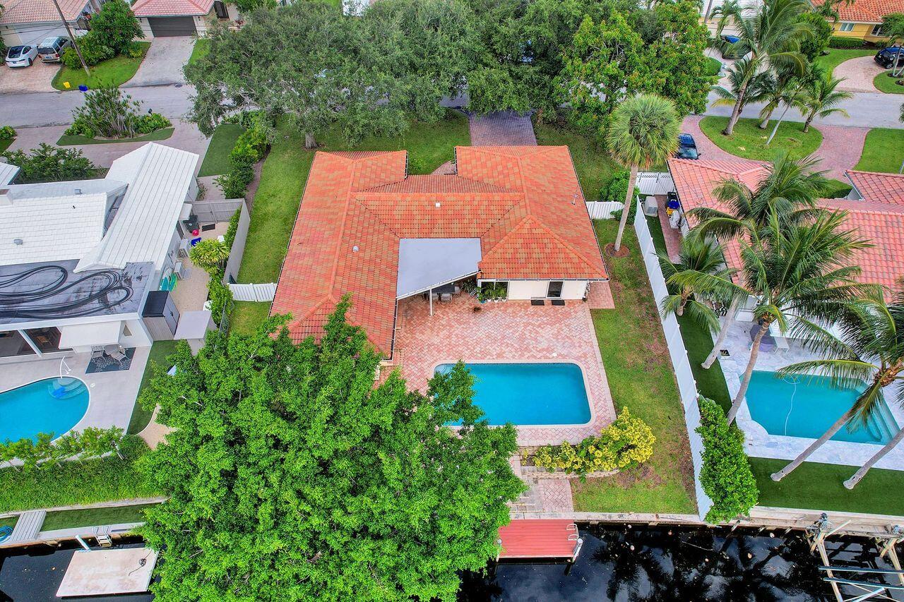 Waterfront Pool Home in East Boca RatonDiscover the perfect blend of comfort, style, and location with this beautifully maintained 3-bedroom, 2-bathroom waterfront pool home, available furnished or unfurnished. Nestled in a serene, family-friendly neighborhood in highly sought-after East Boca, this residence offers an exceptional South Florida lifestyle.Step inside to find an inviting layout with a recently remodeled guest bathroom, newer roof, and spacious living areas that open seamlessly to the backyard oasis. The outdoor space is a true retreat, featuring a sparkling pool, private boat dock, and tranquil water views -- ideal for both relaxing and entertaining. Windows and doors all impact