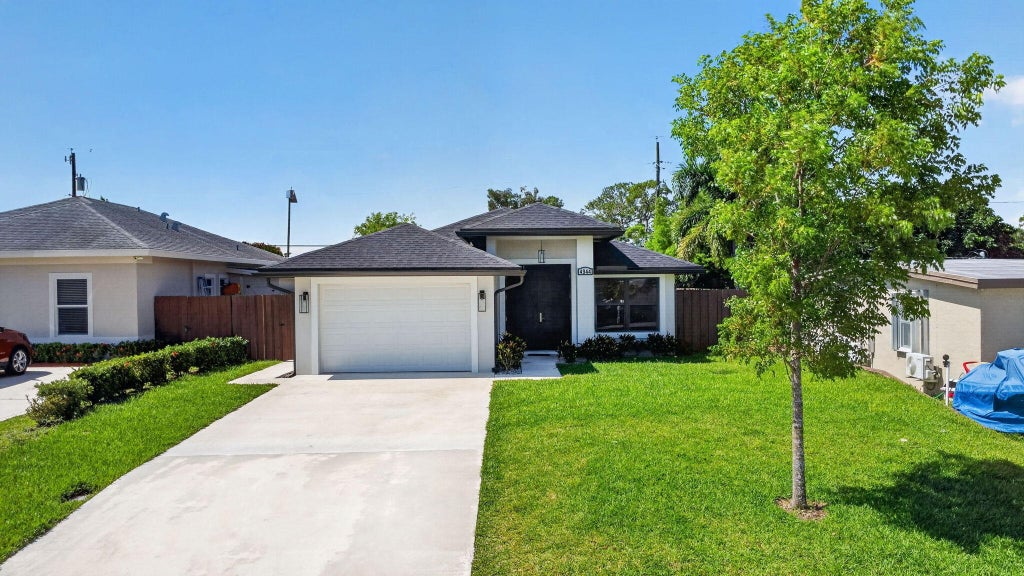 Photo of 4944 Mcconnell Street, Lake Worth, FL 33463 (MLS # B26029856)