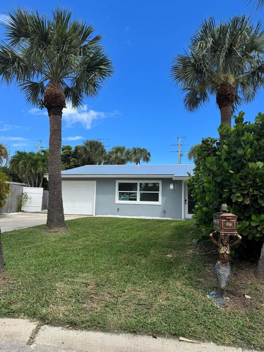 Live in Vacation mode Life truly is better at the beach!  This Charmin 2-bedroom 1 bath home with a 1-caar garage offers additional space behind the fence, perfect for a small boat or jet skis. Inside you will find a spacious master bedroom with additional seating area that can easily be used as a home office, gym or nursery.  French doors open to a patio and large back yard.The kitchen features granite countertops and newer appliances, ready for you to cook up your favorite meals after a day at the beach.Make this Coastal Retreat your Happy Place.!!