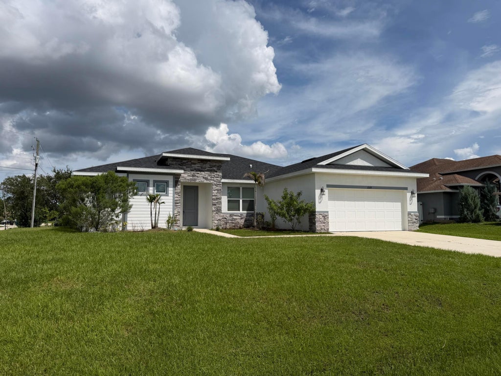 Photo of 2329 SW ALMINAR Street, Port Saint Lucie, FL 34953 (MLS # B26075660)