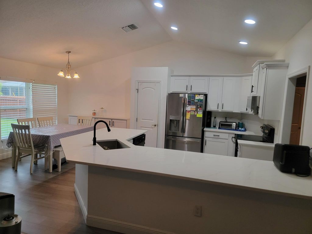 Photo of 1185 SW Hutchins Street, Port Saint Lucie, FL 34983 (MLS # R11104195)