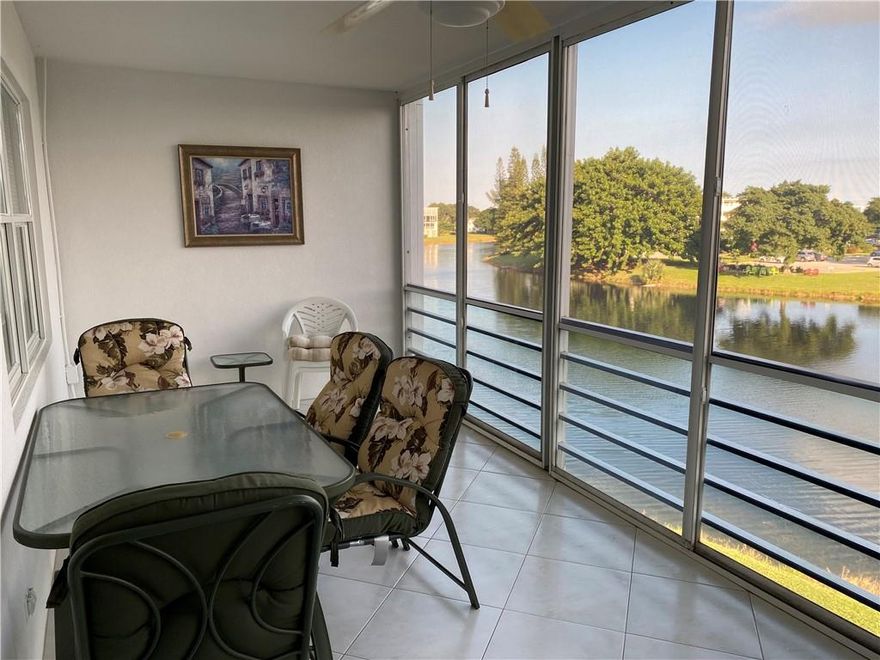 RARELY AVAILABLE! CORNER UNIT, WITH STUNNING  WRAP AROUND WATER VIEW!  2 BEDROOM, 1.5 BATH, FULLY FURNISHED, STAINLESS STEEL APPLIANCES, ALL TILE, NEWER ENCLOSED PATIO..NEWER AIR CONDITIONER. THIS UNIT IS MOVE IN READY ONE OF THE BEST WATER VIEWS IN THE VILLAGE. LOOK OVER WATER FROM DINING ROOM, BEDROOM, AND PATIO. THIS IS THE ONE YOU HAVE BEEN WAITING  FOR. VILLAGE HAS MANY AMENITIES! VERY ACTIVE GATED COMMUNITY WITH CLUBHOUSE THAT HAS FITNESS CENTER, MOVIE THEATER, INDOOR POOL, CRAFT ROOMS, SHUTTLE BUS TO SHOPPING CENTERS AND MALLS. LOCATED APPROXIMATELY 4 MILES TO BEACH. CLOSE TO MAJOR HIGHWAYS, AND TRI RAIL SERVICE. BUILDING HAS DESIGNATED PATIO AREA NEAR THE WATER. THIS IS A NON RENTAL BUILDING.