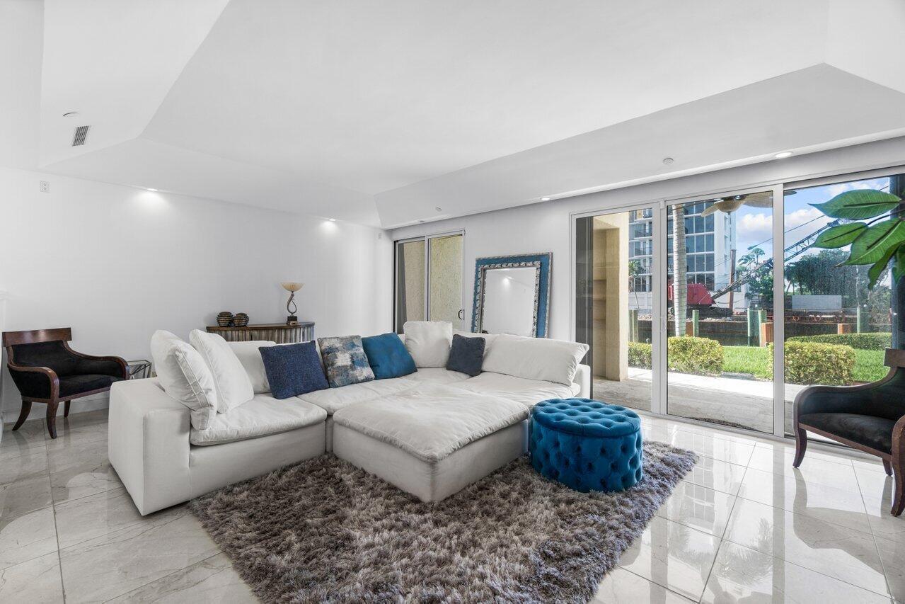 This rarely available, corner townhome in the prestigious Braemar Isle of Highland Beach is ready for you! With stunning water views from the living area, dining room, kitchen, and the master suite, you'll love the peaceful setting. Step right out to the Intracoastal (or your boat) from this ground-floor home.This beautifully renovated home features great outdoor space with a large patio off the living area, primary suite balcony, & the oversized private front patio area! The open and inviting chef's kitchen has extensive granite countertops & stainless steel appliances, while a luxurious primary suite offers double vanities & a walk-in shower with lovely intracoastal views, a secondary washer/dryer and a large wet bar equipped with a wine cooler.