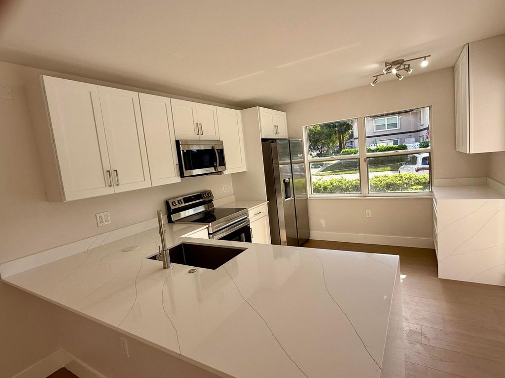 Photo of 19 Amherst Court #C, Royal Palm Beach, FL 33411 (MLS # R11156410)