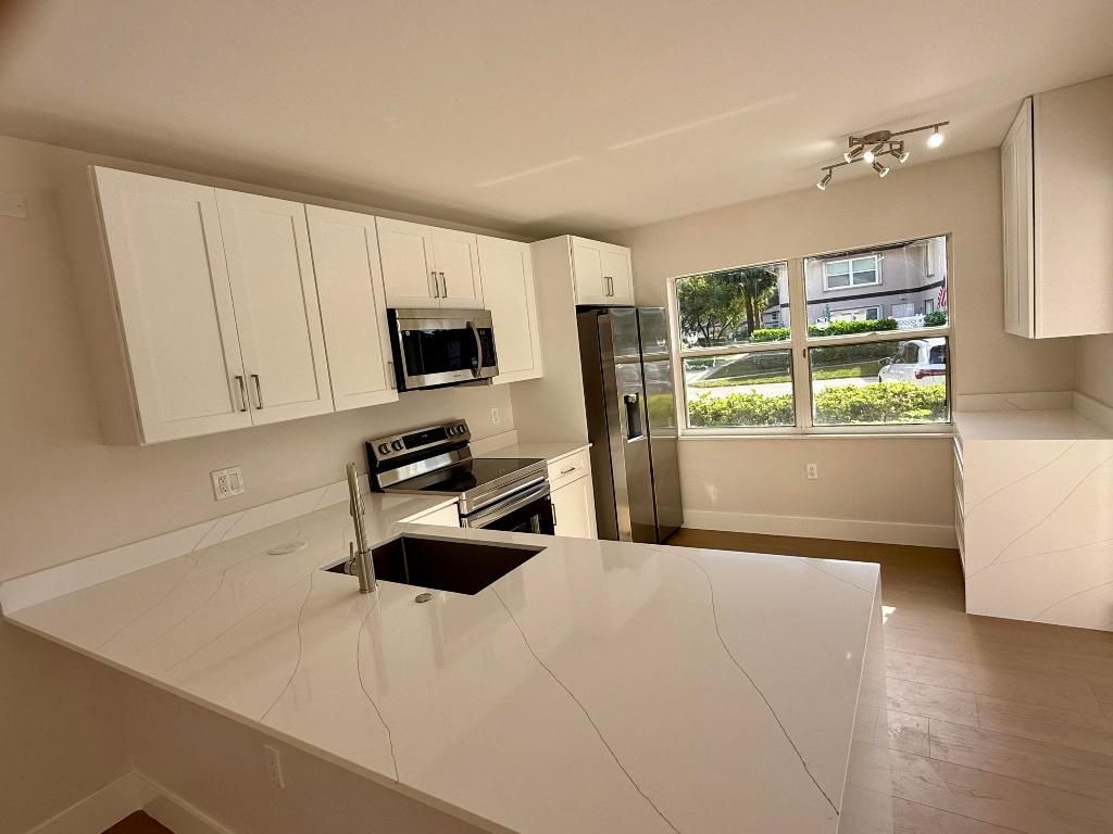 Photo of 19 Amherst Court #C, Royal Palm Beach, FL 33411 (MLS # R11156410)