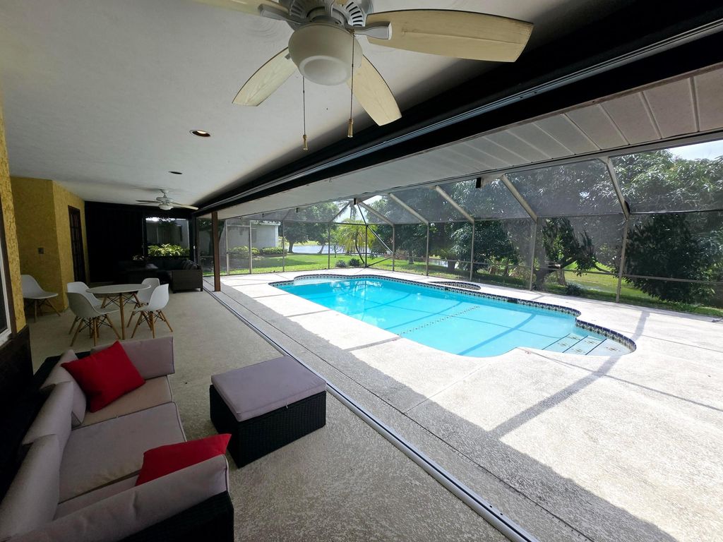 Photo of 2944 NE Loquat Lane, Jensen Beach, FL 34957 (MLS # R11082170)