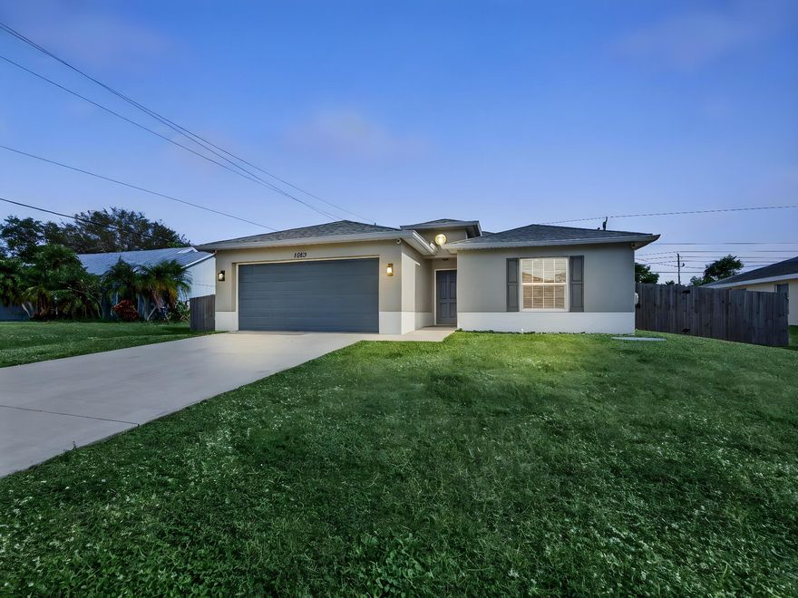 Move-in ready, 4BR/2BA/2CG, CBS home built in 2019, ideally located, featuring a fully fenced yard with room for a pool! A true commuter's delight--minutes to Crosstown Pkwy, I-95 & TPKE, w/shopping & dining close by in Tradition. This meticulously maintained home offers a welcoming foyer, open-concept layout, spacious rooms, tile & LVP flooring, a gorgeous kitchen with stainless steel appliances, oversized pantry, and updated hardware! Large family room features tray ceilings, while the split-bedroom design includes walk-in closets for added storage. Impact windows/doors, designer lighting throughout, plus a screened covered lanai for relaxed outdoor living. The 2-car garage boasts epoxy floors, custom LED lighting, and finished ceiling. Truly turnkey and ready for its new owner!