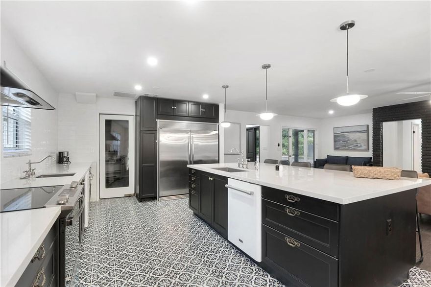 This updated 4-bedroom, 3-bathroom home—with a dedicated office—is ready for your arrival! Situated on an oversized lot of more than one-third of an acre, this private oasis sits on a beautiful, mature tree-lined street. Enjoy an oversized pool and numerous upgrades, including a newer roof, impact windows, a stunning kitchen, a new driveway, and more. Conveniently located within walking distance to multiple houses of worship.