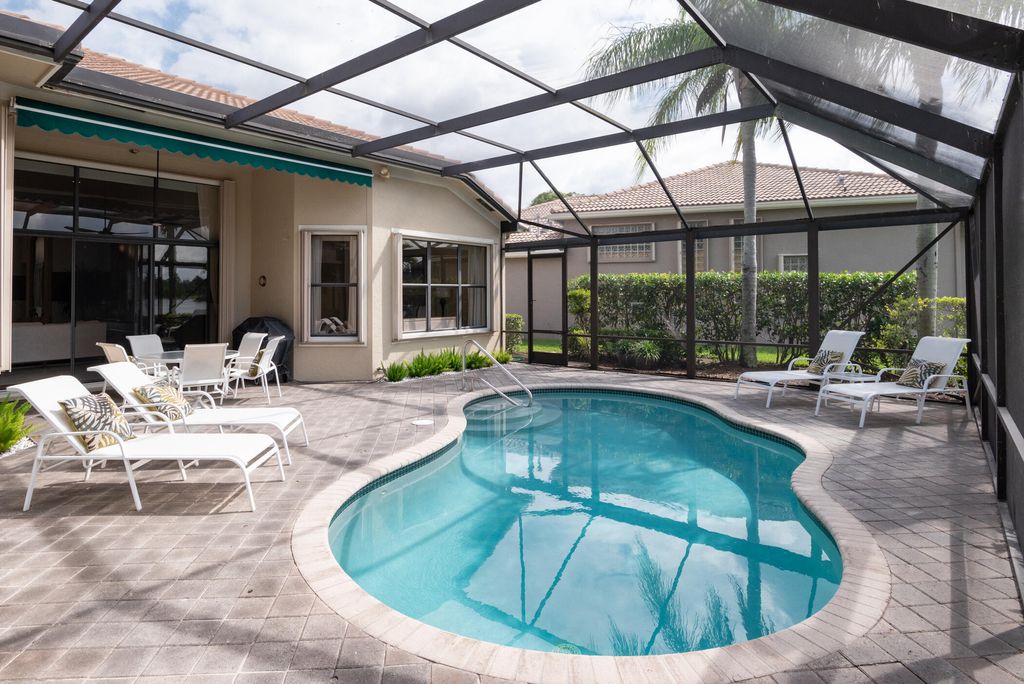 Photo of 10240 Blue Heron Cove, West Palm Beach, FL 33412 (MLS # B26012186)