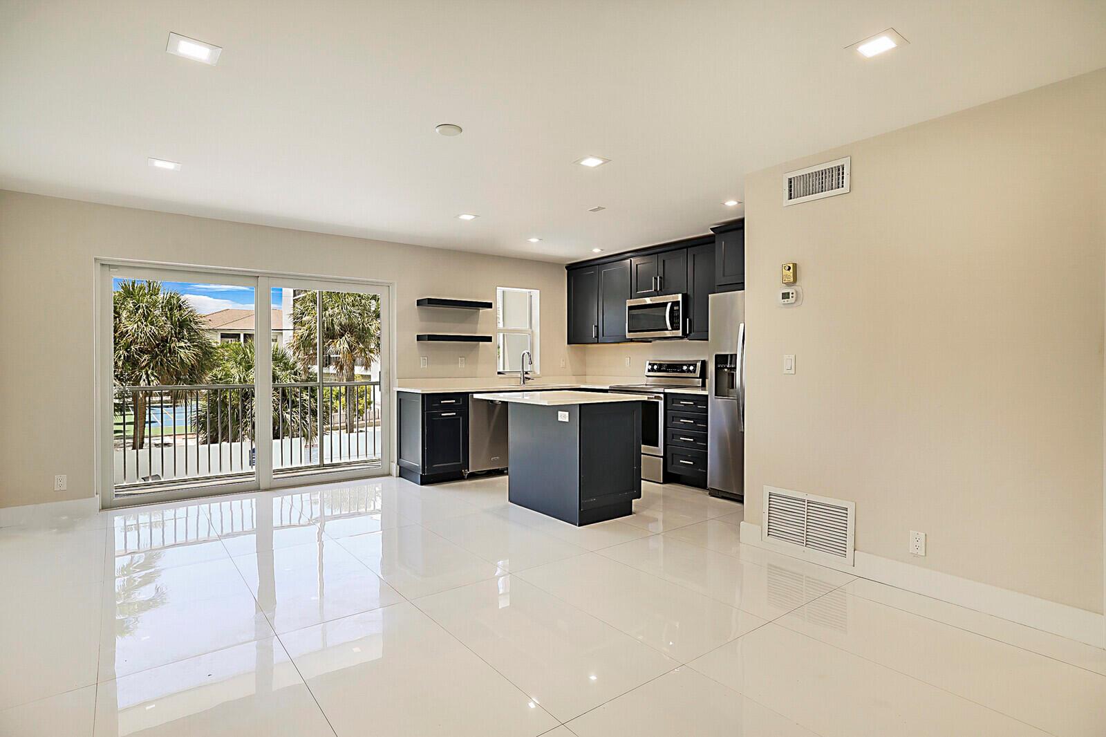 Steps to the Sand! This beautifully updated 1BR/1BA co-op is a coastal gem with private beach access and a serene pool view. Stylish upgrades include impact windows/doors, stainless steel appliances, quartz island kitchen, porcelain floors, and laminate in the bedroom. The renovated bath, screened patio, and plantation shutters add elegance and charm. Enjoy a prime location near dining, shopping, fishing piers & more! Amenities include assigned covered parking, car wash station, and laundry on every floor. Move-in ready beachside living at its best!