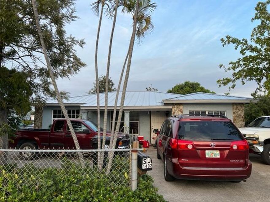 Two houses on this property! The main house is a 3 bed 2 bath that includes ceramic tile, wood and vinyl flooring. Perfect property for investors or someone looking to move in and continue renting the back house out! Convenient location close to Lake Worth Beach, shopping and dining.