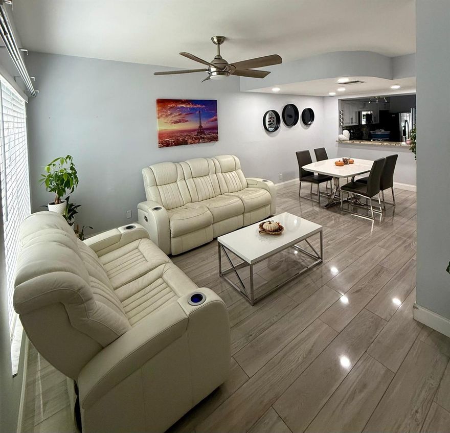 ABSOLUTELY STUNNING WATERFRONT TOWNHOME! ? This fully remodeled 2-bedroom, 1/1.5-bath residence features elegant tile and wood flooring throughout, a breathtaking modern kitchen with granite countertops, stainless steel appliances, and beautifully renovated bathrooms. Enjoy tranquil water views from your home in Fiesta, a highly sought-after gated community for all ages.  HOA includes exterior maintenance and insurance. Community offers a sparkling pool, assigned parking plus plenty of guest spaces. Pet-friendly and no flood zone! Conveniently located near major highways (Turnpike, I-95, Sawgrass), shopping centers, and malls. Move-in ready and close to everything you need! ??