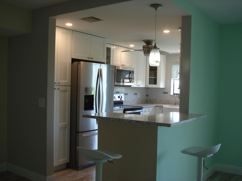 Photo of 5917 VIA VERMILYA #408, Lake Worth, FL 33462 (MLS # B26053230)
