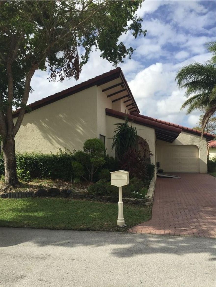 This Villa is in the Woodmont section of Tamarac.  ONLY ONE AVAILABLE IN THIS SECTION. A true 3 bedroom, 2 bath and 1 car garage. Long driveway to park multiple cars. The home backs up to a large park-like area. Home is over 2,200 sq. feet under air. Large kitchen. Huge family room with sliding glass doors to the outside patio. Great home for entertaining. Great location for shopping, restaurants and all major roadways. Community Pool.