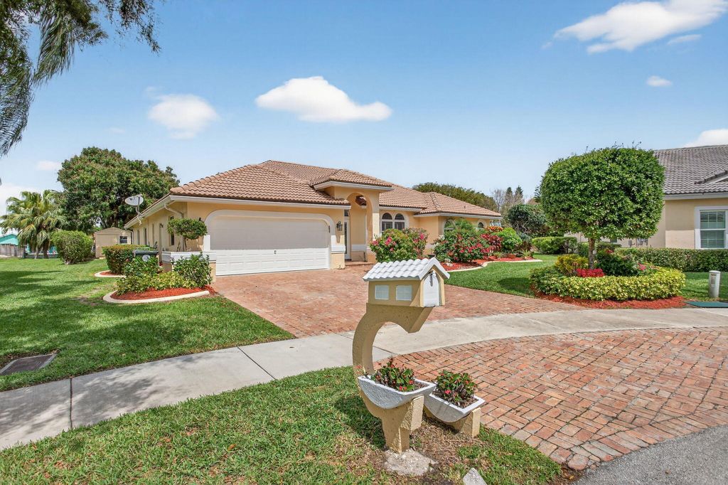 Photo of 5670 NW 38th Terrace, Coconut Creek, FL 33073 (MLS # B26009370)