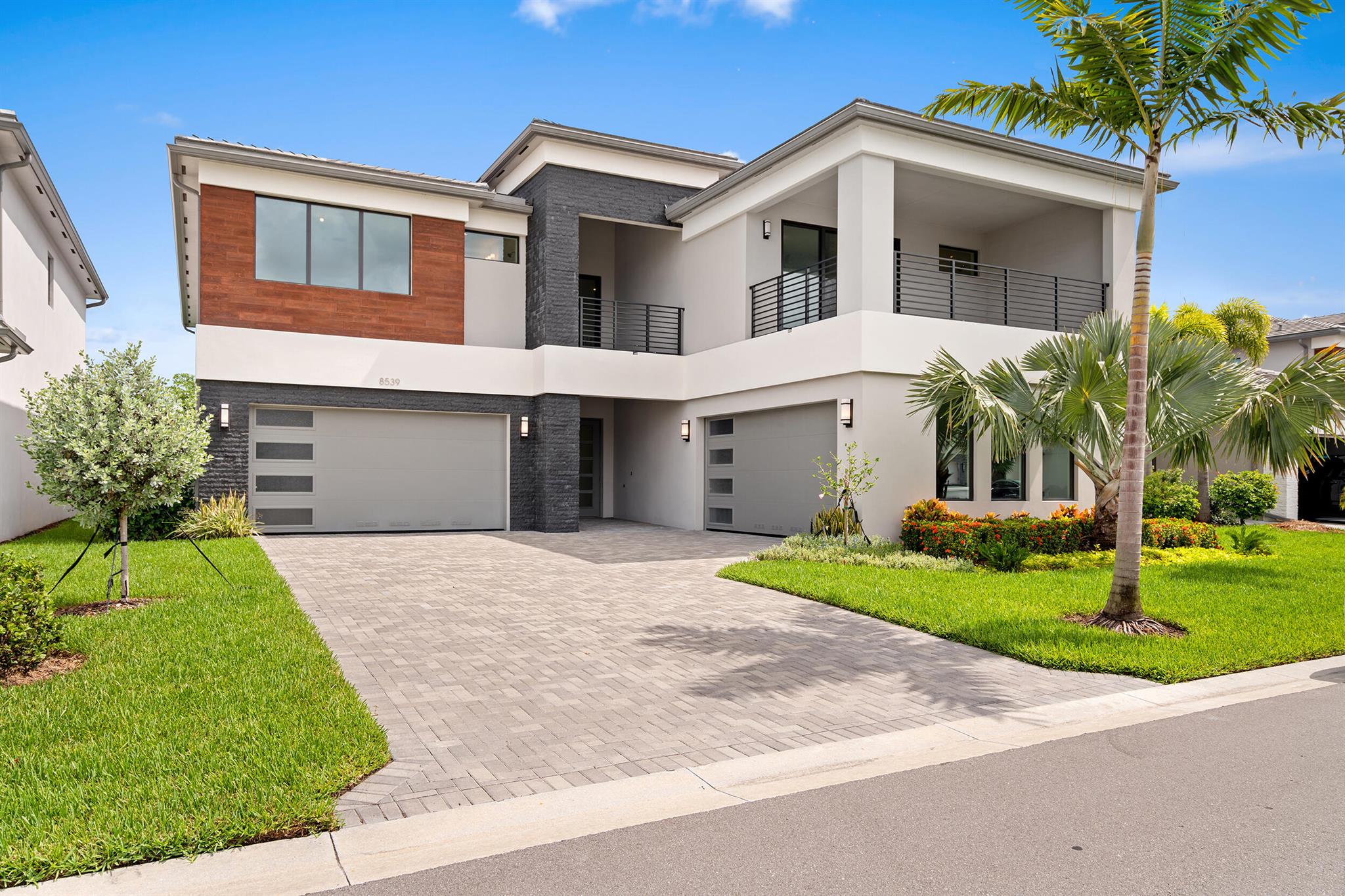 Step into refined luxury in the prestigious Lotus Palm community with this exceptional Maldives model from the sought-after Bali Collection. Brand new and never lived in, this expansive and elegantly designed residence offers over 5,393+/- sq ft of air-conditioned living space, featuring 5 spacious bedrooms, 6 beautifully appointed full bathrooms, 2 half baths, a sophisticated club room, a state-of-the-art media room, a versatile loft, and a 4-car garage.Perfectly situated on a premium lot with serene garden views, this home offers a peaceful and private setting. The ideal retreat for elevated everyday living.