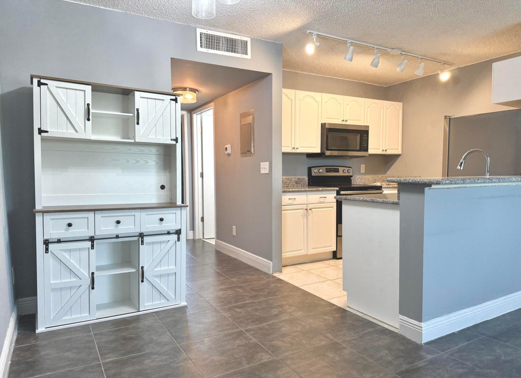 Photo of 1625 Meadows Circle W, Boynton Beach, FL 33436 (MLS # B26068452)