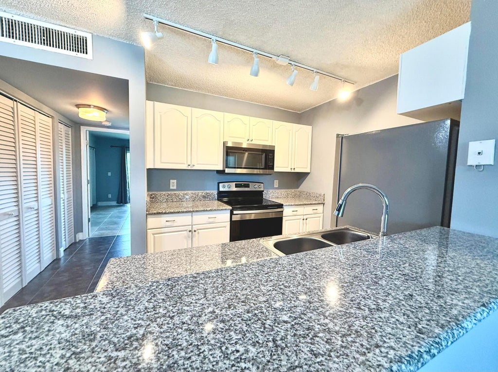 Photo of 1625 Meadows Circle W, Boynton Beach, FL 33436 (MLS # B26068452)