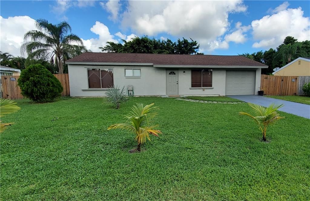 Photo of 2038 SE Hideaway Cir, Port Saint Lucie, FL 34952 (MLS # F10304377)