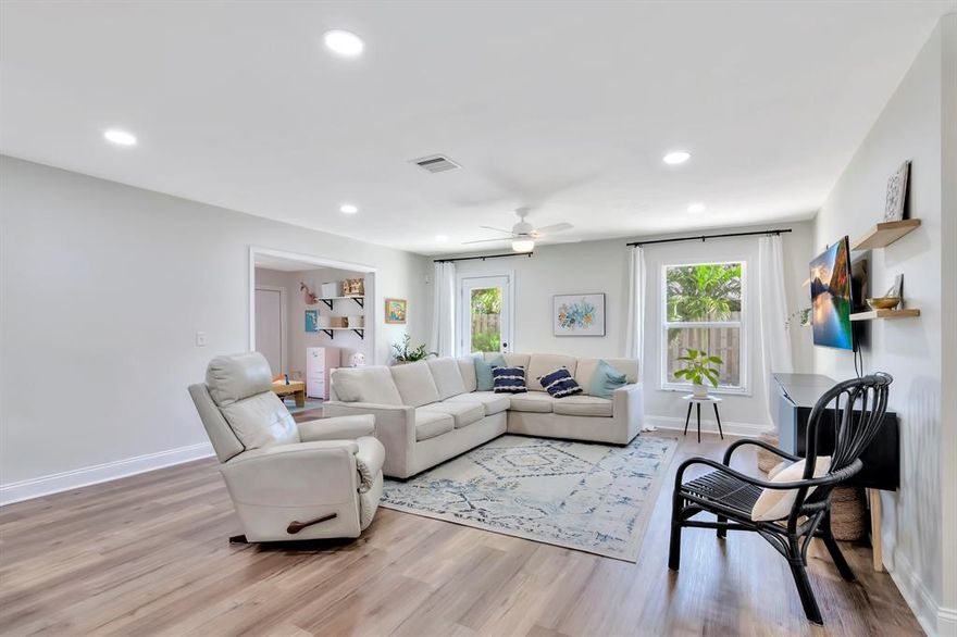 NO HOA in the heart of Wellington! This beautifully maintained home boasts 3 bedrooms plus an office and additional bonus room, 2 bathrooms, spacious kitchen, NEW flooring, NEW AC, NEW fence, updated interior lighting, oversized driveway, all NEW irrigation system, and a gorgeous low maintenance back yard with new pavers, fresh landscaping and artificial turf.  The home is located in a sought after neighborhood with A+ rated schools.  Let's get you moved in!