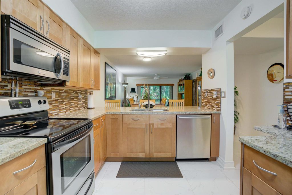 Photo of 2001 Sabal Ridge Court #B, Palm Beach Gardens, FL 33418 (MLS # R10904657)