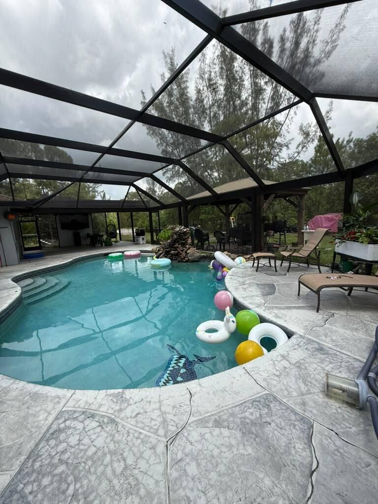 Photo of 17995 31ST Road N, The Acreage, FL 33470 (MLS # B26058069)