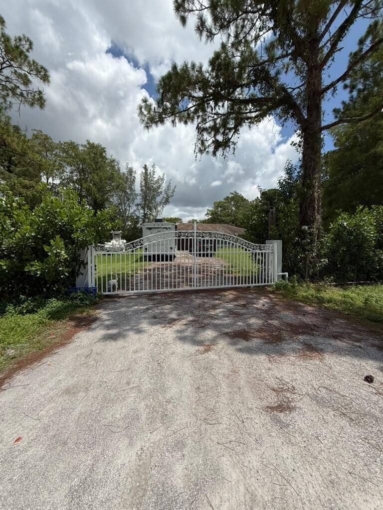 Photo of 17995 31ST Road N, The Acreage, FL 33470 (MLS # B26058069)