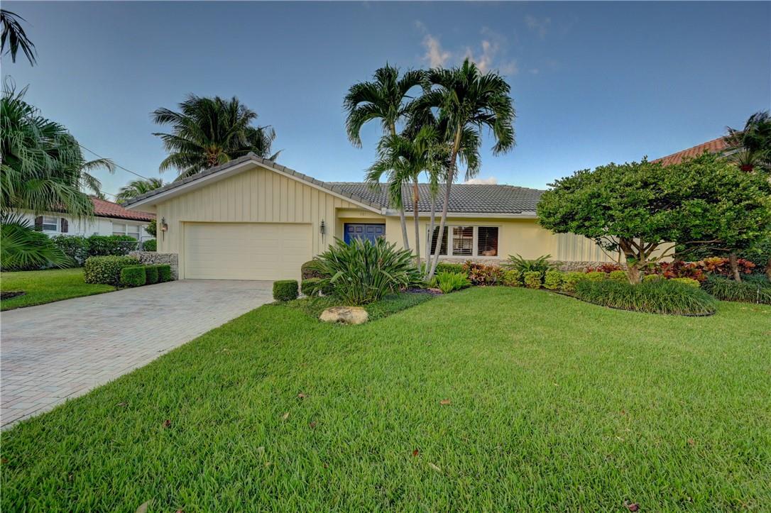 Live in paradise with this beautifully renovated 4 bedroom home on a wide canal in coveted Blue Inlet. Enjoy stunning water views, no fixed bridges and easy ocean access. Beautiful brand new luxury flooring throughout the house. Enjoy outdoor living with a heated pool, spacious covered patio, and upgraded dock with 30-amp power and water. Features include open floor plan with large kitchen, dining area, family room and spacious living room. Split bedroom layout. Whole house generator, solar hot water heater, and 2-car garage. Pet friendly. Pool and Lawn maintenance included. Close to the beach, Mizner Park, and shopping.