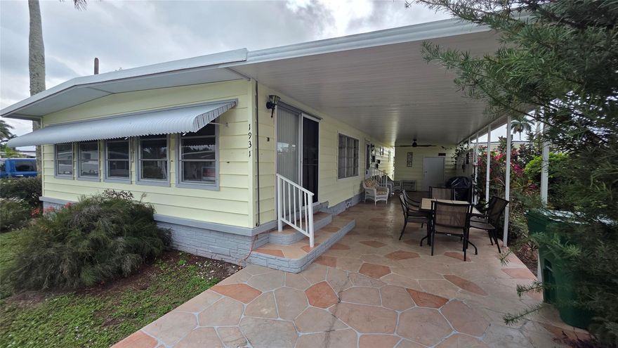 Bright, move-in ready double-wide offering comfortable single-level living in a welcoming 55+ community. This fully furnished 2-bedroom, 2-bath home shows like a model and includes a spacious Florida room currently used as a private 3rd bedroom — perfect for guests, a hobby room, or a quiet reading space. The open living and dining area flows to a practical kitchen and creates an easy entertaining footprint for family and friends.

Outside, you’ll find a generous entertaining area — ideal for barbecues, morning coffee, or evening get-togethers — plus pleasant landscaping that keeps maintenance low. Located minutes from the airport and nearby conveniences, this home combines relaxed, retirement-friendly living with excellent access to travel, shopping and dining.