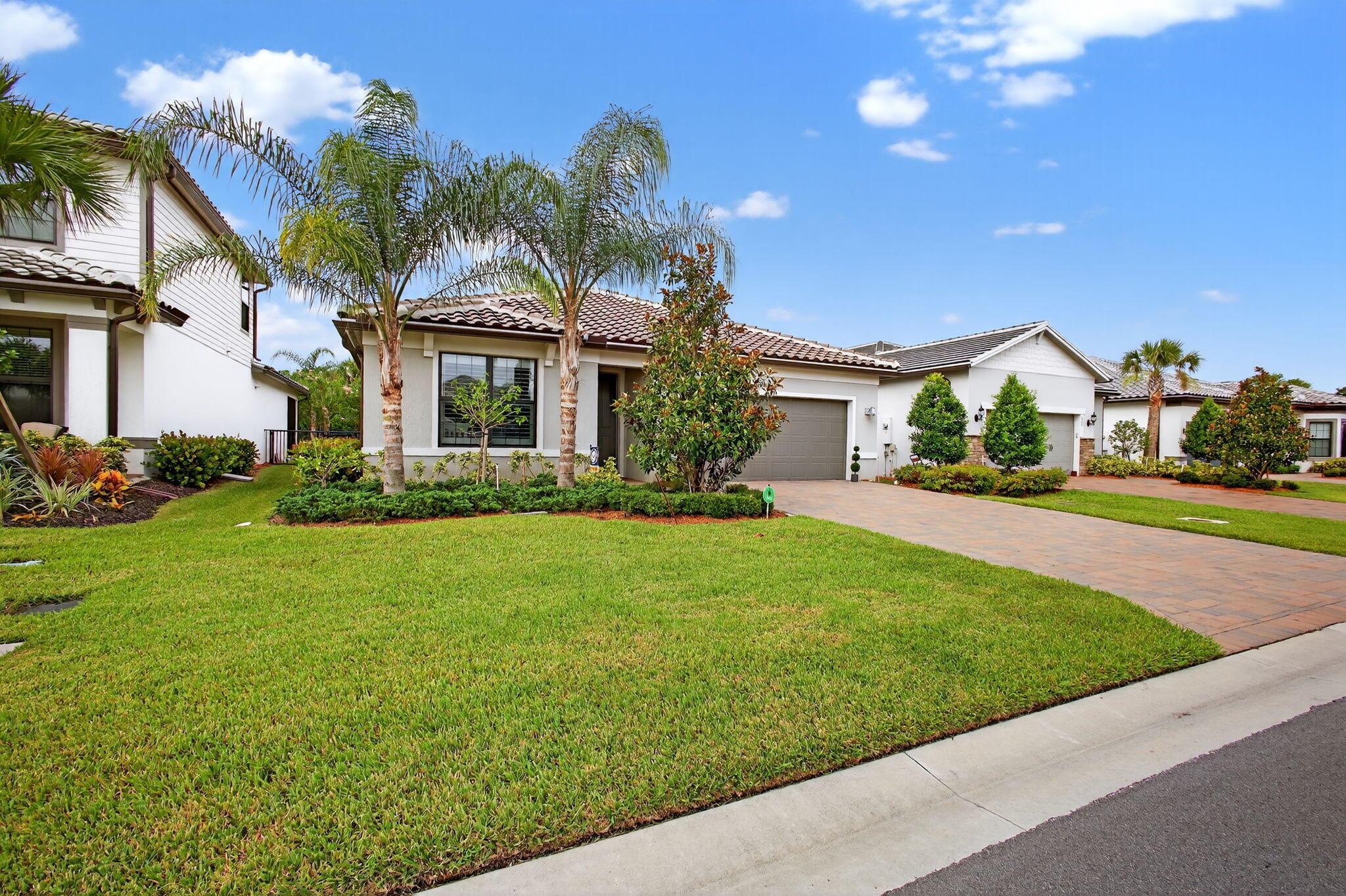 Gorgeous model-like home in the sought-after Veranda Gardens community! This immaculate 3-bed, 2-bath features wood-look tile throughout, custom kitchen island, granite countertops, subway tile backsplash, upgraded cabinetry, gas range, and stainless appliances. The primary suite offers a coffered ceiling and custom-built closets. All closets have built-ins and plantation shutters in every room. Includes washer/dryer with pedestals, garage fridge, and upgraded UV A/C system. Prewired for a pool, with negotiable patio furnishings, backyard swing set, and other furnishings. Enjoy resort-style amenities--lap pool, clubhouse, fitness center, tennis, pickleball, and more in this gated community!