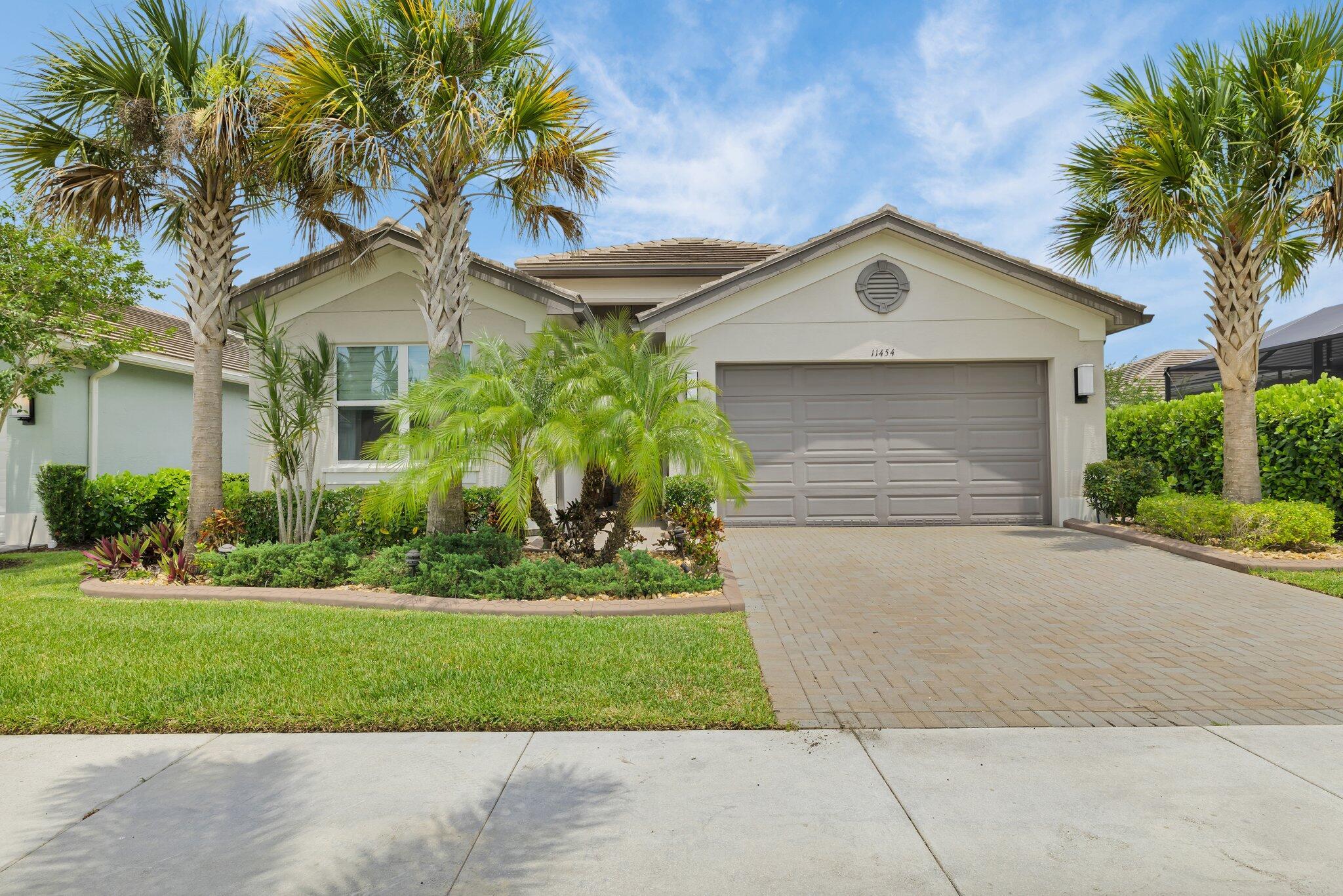 FOR SALE - Heron Model, 2 bedrooms, 2 bathrooms plus an office/flexroom, with Long Water View in Valencia Cay at Riverland. Welcome to your slice of paradise in the 55+ resort-style community of Valencia Cay! This beautifully upgraded Heron model offers 2 bedrooms plus an office/flexroom and 1,716 sq. ft. of thoughtfully designed living space, all enhanced by a stunning long lake view and morning sun from the east-facing lanai. From the moment you arrive, you'll appreciate the home's curb appeal with upgraded elevation, decorative concrete flower bed curbing, and an extended paver walkway. Inside, sophisticated finishes abound - 12'' x 24'' porcelain tile flows throughout, complemented by soft gray tones from a full-home repaint just one year ago. Crown molding graces the foyer