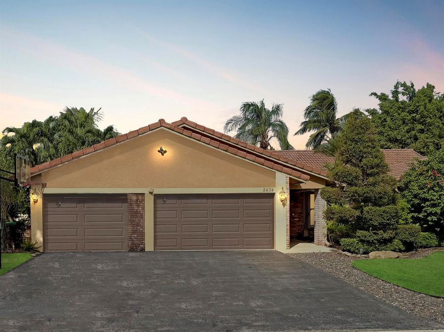 Welcome home to this beautiful 4-bed, 2.5-bath pool home offering over 2,000 sq ft of living space on a quiet, tree-lined street in Coral Springs' desirable Pine Ridge community. The open-concept layout features vaulted ceilings, a spacious family room with a stone accent wall and mood fireplace, and a chef's kitchen with granite counters, dual ovens, induction cooktop, wine fridge, and a large island for gathering. Bedrooms are conveniently arranged on one side, maximizing living space. Step outside to your private tropical retreat with a sparkling freeform pool, pergola, fire pit, and multiple lounge areas surrounded by lush landscaping. A 3-car garage provides ample storage. Lawn and pool care included, no HOA approval, and pets welcome!