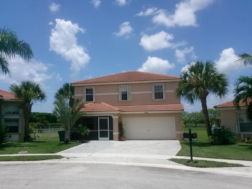 Amazing 4/2.1/2 Home in the Beautiful City of Wellington. The house is Bright and Airy and it Sits in a Fabulous & Extremely Large Cul-de-sac. The house also has an Over-Sized Fenced Yard which backs to a large green area and the preserve. The lot is definitely a premium site. This Home is Ready to Move-in and it features a dining-living-family room & a breakfast area. Wine bar & pantry have been added for extra storage & convenience. There is a Separate laundry room & 1/2 bath downstairs. Laminate flooring on first floor. Second floor features 4-bedrooms & 2 bathrooms. The Master Bedroom and bathroom are spacious & the Master Bedroom sliding doors lead to open balcony with panoramic & spectacular yard. Accordion shutters on 2nd floor. HOA includes Front Lawn Care, Cable, 7-days Police Officer Patrol, Club-house, Community room, Exercise room, Basketball & Tennis courts, Bike-Jog, On-Site Manager, Picnic areas and 2-pools. Dimensions stated are approximations and are not guaranteed.